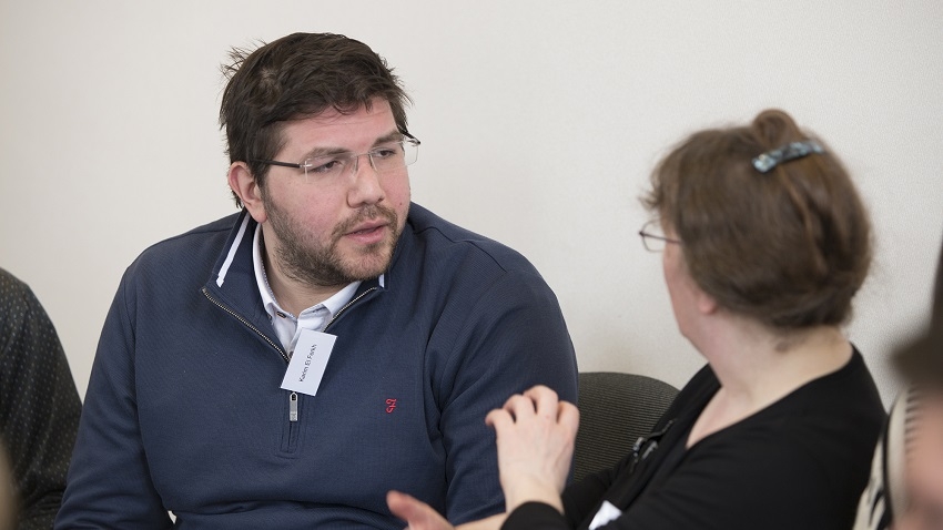 Karim el Ferkh in conversation with another researcher